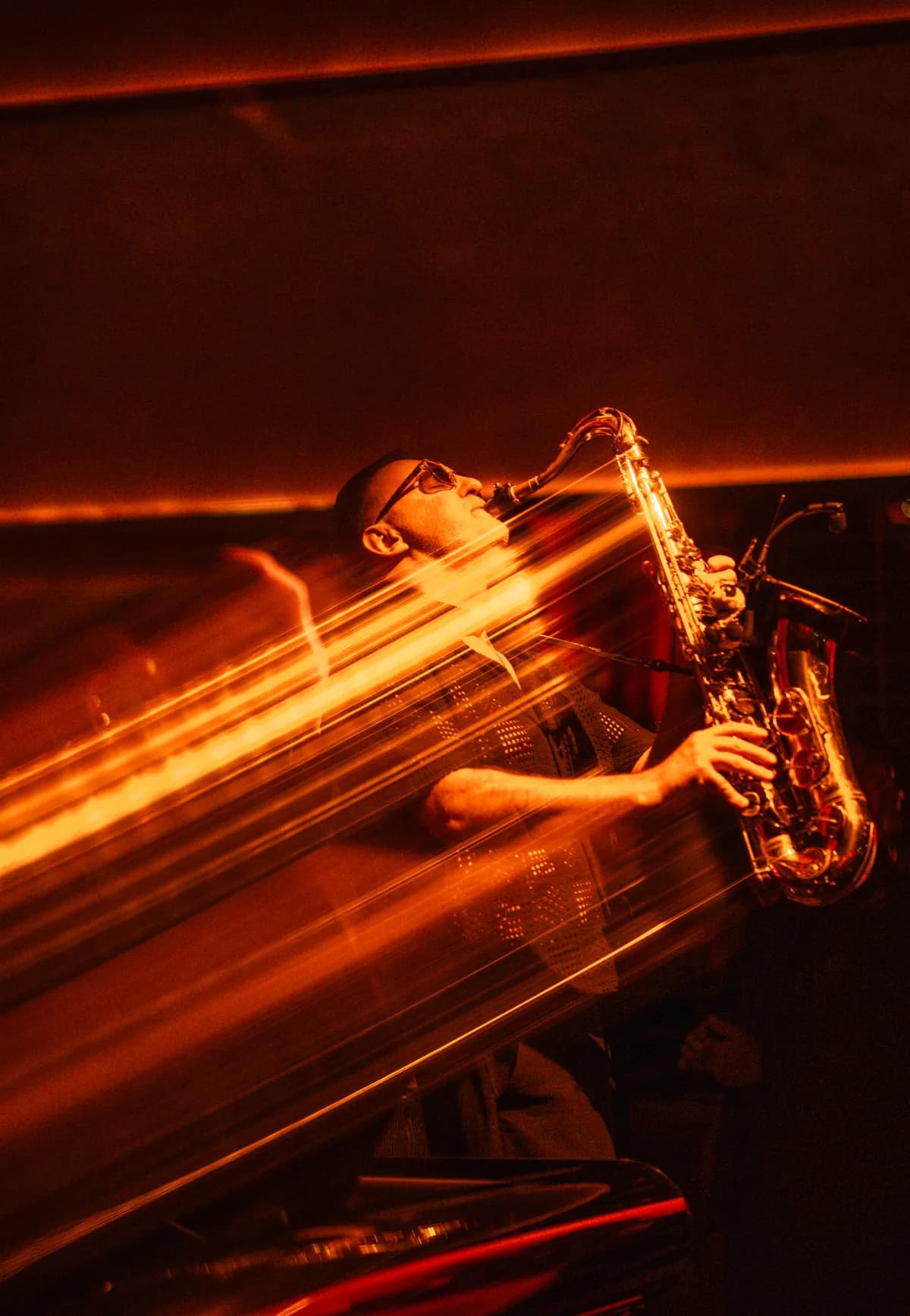 A live saxophonist performing at MIRA Club Bangkok