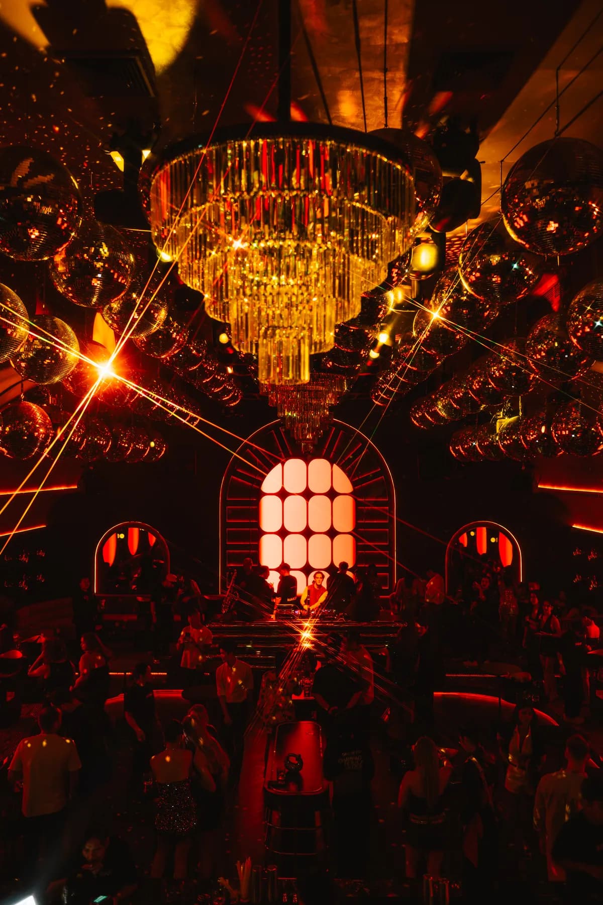 The chandelier and crowd beneath the arch at MIRA