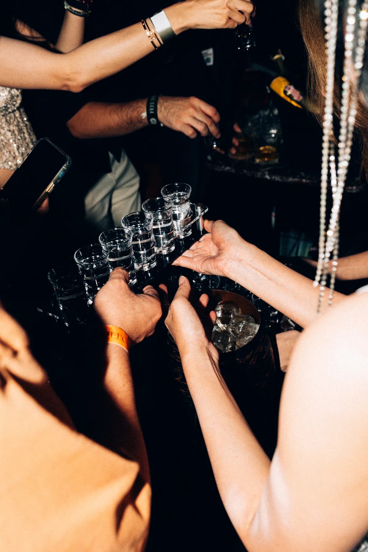 A champagne toast on the floor at MIRA Club Bangkok